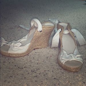 Strappy tie up leg wedge heels.